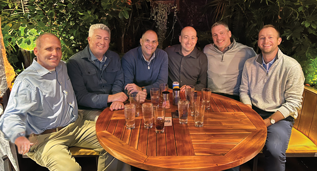 “Do you guys sell medical equipment?”: That was the question asked of this group by the stoner who walked by. Maybe you could say they sell medical equipment for the turf industry? From left to right are Golfdom’s Jones, Stoltman, Tod McClosky, MacGregor with Ryan Karapas, Quali-Pro. (Photo: Golfdom staff)