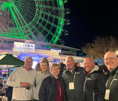 Jones with the team from PBI-Gordon, and outgoing GCSAA president T.A. Barker. Only now does Jones realize why he kept seeing the PBI-Gordon folks in that area. Still, the Ferris wheel at ICON Park looks cool. (Photo: Golfdom staff)