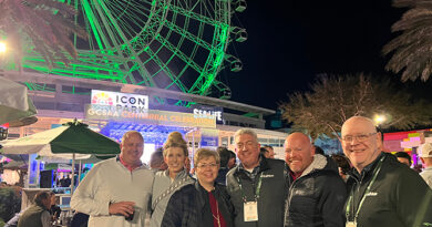 Jones with the team from PBI-Gordon, and outgoing GCSAA president T.A. Barker. Only now does Jones realize why he kept seeing the PBI-Gordon folks in that area. Still, the Ferris wheel at ICON Park looks cool. (Photo: Golfdom staff)