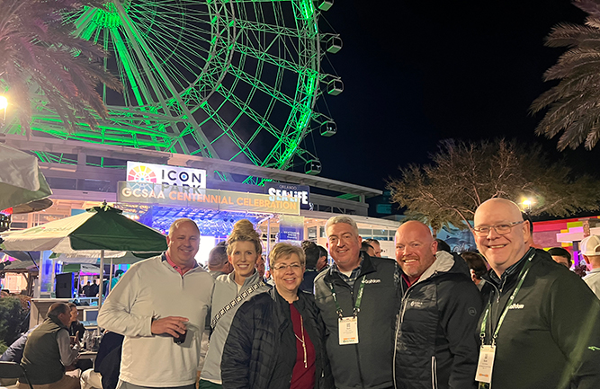 Jones with the team from PBI-Gordon, and outgoing GCSAA president T.A. Barker. Only now does Jones realize why he kept seeing the PBI-Gordon folks in that area. Still, the Ferris wheel at ICON Park looks cool. (Photo: Golfdom staff)
