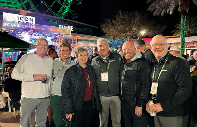 A Kansas City party in Orlando!: (From left to right) Tim Nielsen, superintendent, The GC at Creekmoor, Raymore, Mo.; Callie Zevecke, marketing communications project manager, PBI-Gordon; Jackie Applegate, president and CEO, PBI-Gordon; Jones; outgoing GCSAA President, T.A. Barker, CGCS, Fore Lakes GC, Taylorsville, Utah; and Hollister smile for a photo at GCSAA’s 100th anniversary party at ICON Park. (Photo: Golfdom staff)