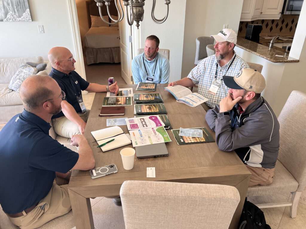 Seeing autonomous solutions demonstrated in person was a bonus at the Summit, but attendees also enjoyed the opportunity to meet face-to-face with the companies that create the chemistries they rely on, like this meeting with the team at Quali-Pro. (Photo: Golfdom staff)
