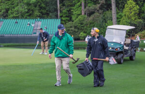 Two members of the maintenance crew at Augusta National Golf Club share a laugh during work. “Dr. Duich said it, ‘It’s 10 percent turfgrass and 90 percent people,’” Owen says. (Photo: Scott Ramsay)