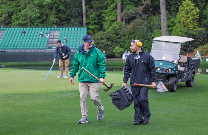 Two members of the maintenance crew at Augusta National Golf Club share a laugh during work. “Dr. Duich said it, ‘It’s 10 percent turfgrass and 90 percent people,’” Owen says. (Photo: Scott Ramsay)