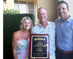 Native bird advocate Brian Beckner (middle) with wife, Susan, and his award from the Florida GCSA presented by president Ryan Swilley, CGCS (right), from The Dye Preserve Golf Club. (Photo: Florida GCSA)
