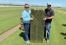 Roberto Gurgel and Joel Lane with a slab of HighPoint Bermudagrass. (Photo: Sod Solutions)